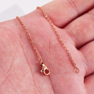 Rose gold plated stainless steel square cross chain necklace with a lobster clasp