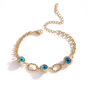 Gold-plated stainless steel devil eye bracelet with blue charms and twisted rings