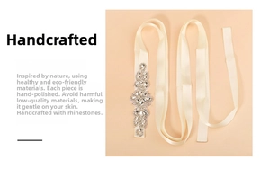 Detail of handmade bridal belt with sparkling crystal rhinestones on ivory satin ribbon