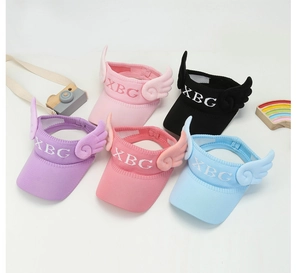 Detail of five colorful kids' open top sun hats with knit mesh and wing ornaments
