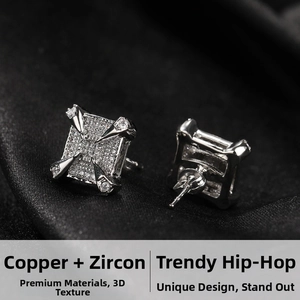 Detail of square zircon ear studs with dragon claw design and butterfly backs in silver finish