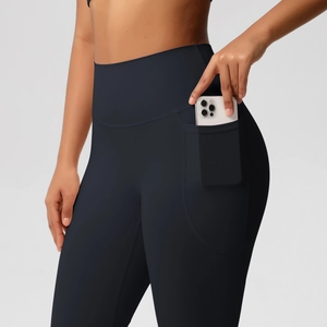 Detail of high waisted yoga leggings featuring a large functional side phone pocket