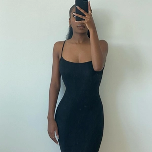 Detail shot of a black slim-fit spaghetti strap bodycon midi dress in a mirror selfie