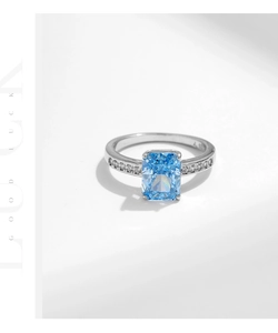 Close-up of S925 silver ring with rectangle light blue stone and side diamond accents