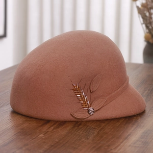 Detail of wool felt equestrian hat featuring exquisite beaded wheat and floral accents