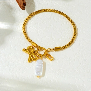 Bracelet en acier inoxydable doré avec nœud, perle baroque et pendentif zircon