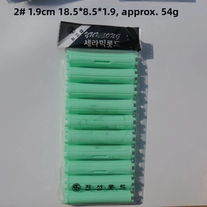 Detail view of 1.9cm green plastic hair perm rods in transparent PVC packaging