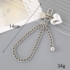 Detailed view of silver heart keychain chain showing 14cm length and 34g weight specs