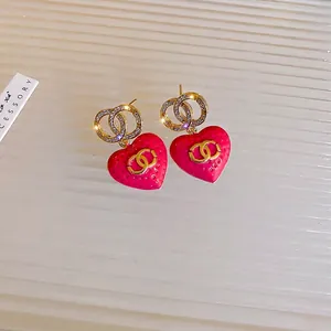 Gold-plated heart earrings with strawberry texture and sparkling crystal CC logo charms
