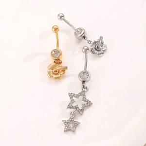 Detail of silver heart and flower belly rings with star charms and zircon inlay