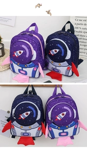 Close-up of purple and navy rocket toddler backpacks with 3D space shuttle design details