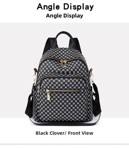 Front view of large waterproof travel backpack with black clover print and gold zippers