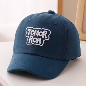 Detailed white TOMORROW embroidery on dark blue cotton twill baseball cap for kids