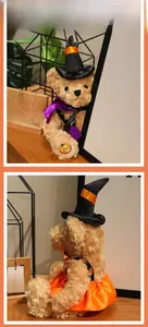 Detailed view of Halloween teddy bear plush with witch hat and pumpkin print dress