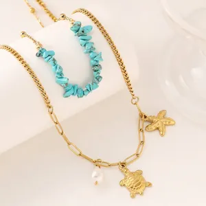 Double-layered starfish and turtle pendant necklace with gold chain and turquoise stones