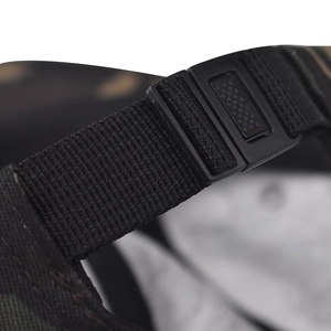 Detail of adjustable black nylon strap and plastic buckle on the cotton baseball cap