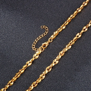 Minimalist gold coffee bean link necklace with lobster clasp on black background