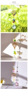 Macro detail of crystal suncatcher pendants showing rainbow refraction and metal patterns
