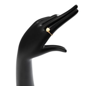 Close-up of handmade gold wire-wrapped ring with a round opal gemstone on black display