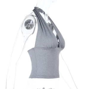 Detailed side view of grey halter neck crop top showing ribbed knit fabric texture