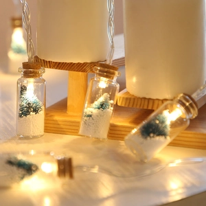 LED wishing bottle fairy lights with mini Christmas trees and snow inside glass jars