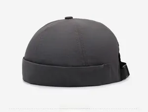 Side view of dark charcoal gray docker cap showing quick-dry fabric and strap