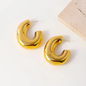 Minimalist chunky C-shaped golden titanium steel hoop earrings with polished finish