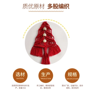 Close-up of handmade red macrame Christmas tree ornament with natural wood beads