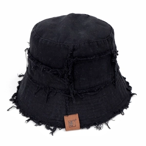 Frayed edge black bucket hat with vintage leather patch and street style design