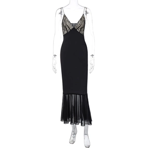Detail of lace stitching V-neck and sheer mesh fishtail hem on a black strap dress