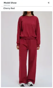 Women's cherry red sweatshirt and wide-leg jogger set shown on a full-body model