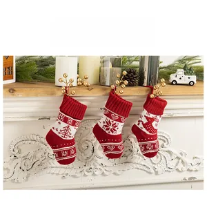 Detailed knit of Christmas stockings featuring tree, snowflake and reindeer patterns
