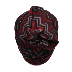 Close-up of red, black, and grey knitted wave pattern on a warm winter neck gaiter