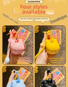 Detail view of colorful temple block keychains in pink, yellow, blue and black colors
