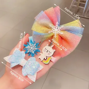 Frozen-inspired girls' hair clip set featuring glitter snowflakes and rainbow mesh bows