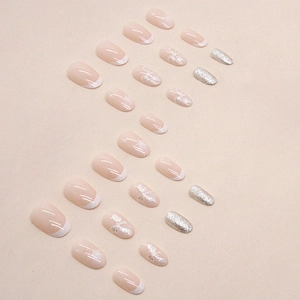 Oval French manicure set with white bows and champagne glitter faux nail tips