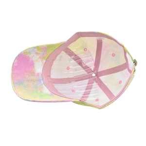 Detailed interior of tie-dye baseball cap showing pink sweatband and adjustable buckle