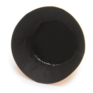 Yellow and black reversible cotton bucket hat with white dream embroidery and stitching