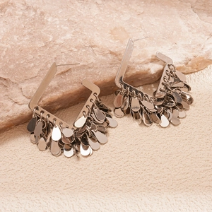 Detailed close-up of 18K gold-plated square waterdrop tassel earrings on a stone background