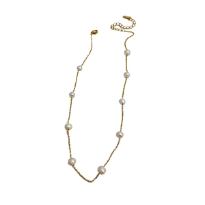 Elegant gold plated pearl necklace featuring white baroque pearls on a fine metal chain