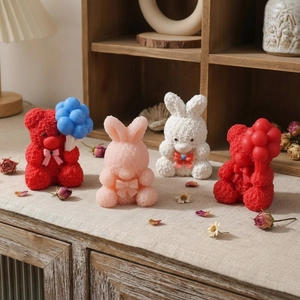 Silicone molds for bear and rabbit shaped scented candles with bow details and balloons