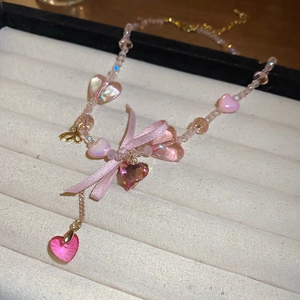 Sweet pink beaded necklace with heart resin pendants and a ribbon bow choker style