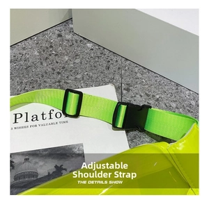 Detail of neon green chest bag featuring adjustable nylon strap and black plastic buckle