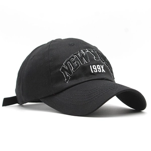 Classic black cotton baseball cap with white New York 199X embroidery in a vintage style