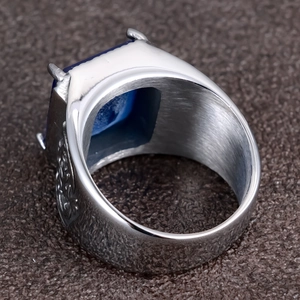 Men's vintage stainless steel ring featuring a square blue sapphire and engraved patterns