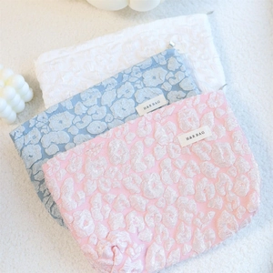 Embossed cloud cosmetic bags in pink blue and white colors with jacquard floral texture