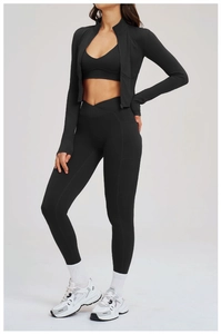 Close-up of women's black 3-piece fitness set with V-shaped crossover waist leggings