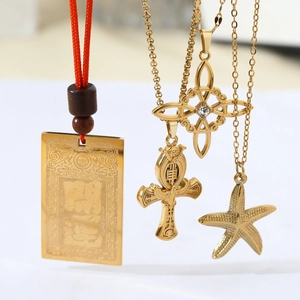 Golden stainless steel necklace set with clover, cross, eagle and starfish pendants