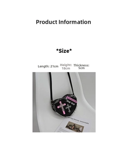 Detail shot of heart-shaped punk crossbody bag with rivets and pink cross embroidery