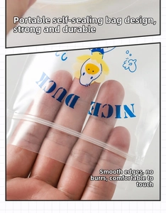 Detail of transparent PE zipper bag with cartoon duck print and secure sealing strip